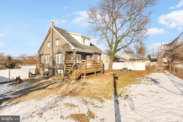 view of front of house featuring a deck and central AC unit