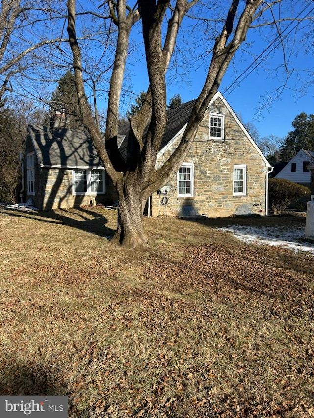 view of home's exterior featuring a lawn