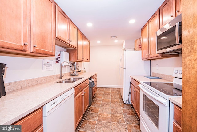 kitchen with sink and white appliances