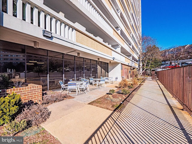 view of home's community with a patio area