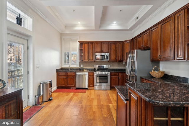 kitchen featuring plenty of natural light, sink, backsplash, and stainless steel appliances