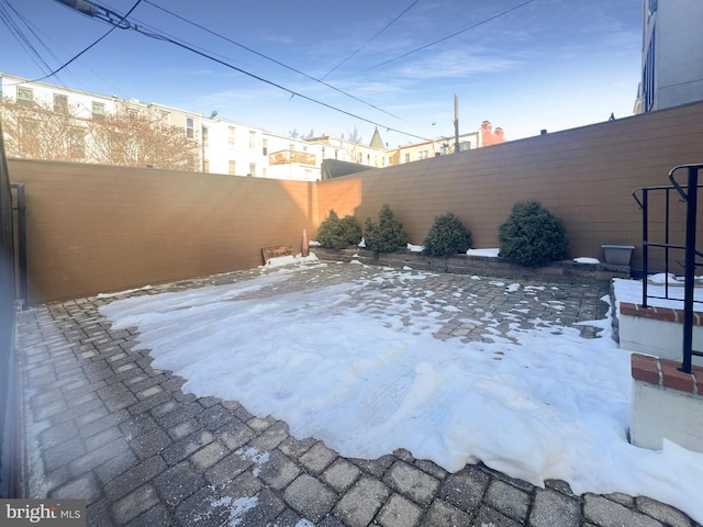 view of yard covered in snow