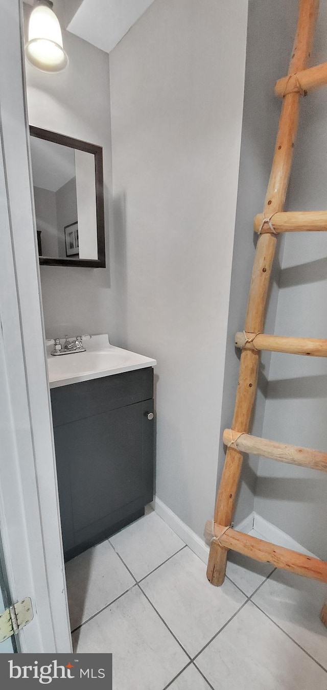 bathroom with tile patterned flooring and vanity