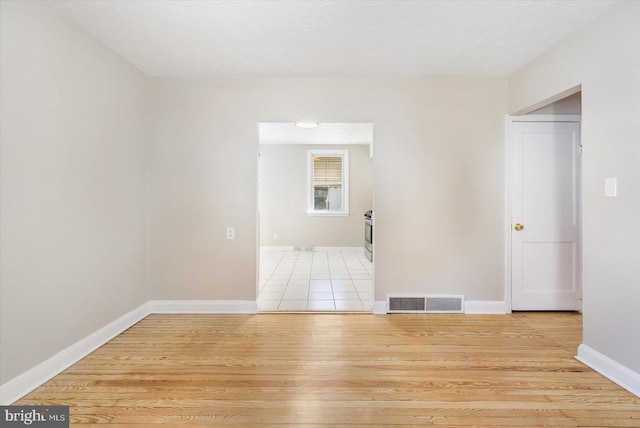 unfurnished room featuring light hardwood / wood-style floors