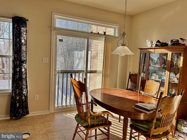 dining room with light tile patterned flooring