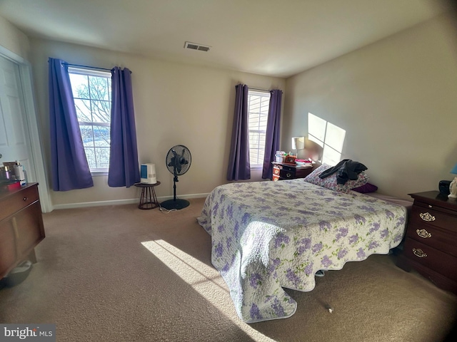 bedroom with light carpet