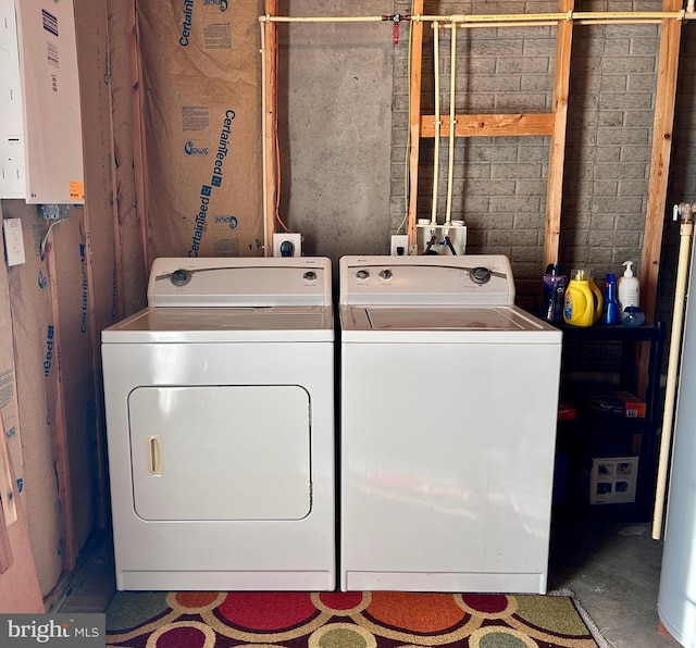 laundry area with independent washer and dryer