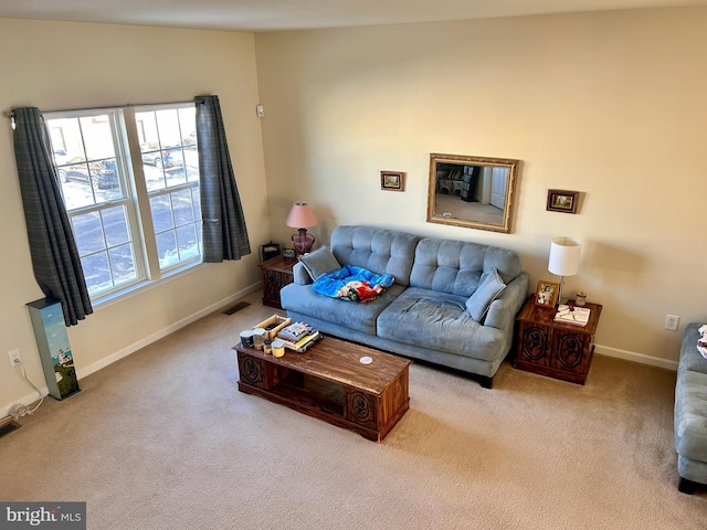 living room featuring light carpet