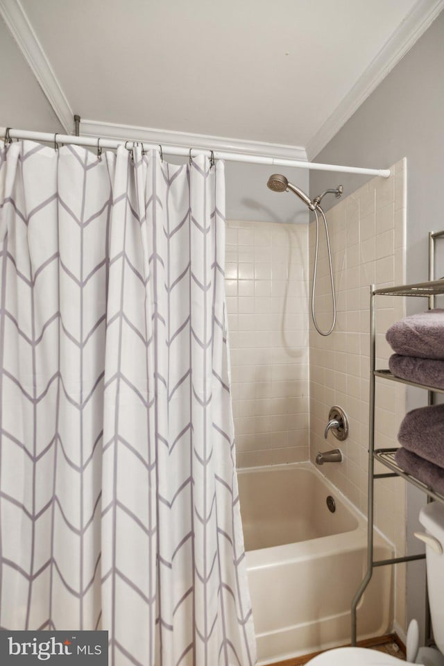 bathroom featuring shower / bath combo and ornamental molding