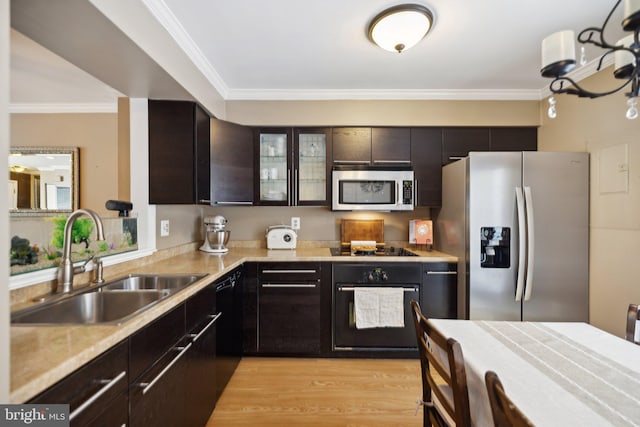 kitchen featuring crown molding, sink, dark brown cabinets, and black appliances