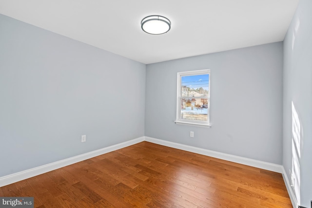 empty room featuring wood-type flooring