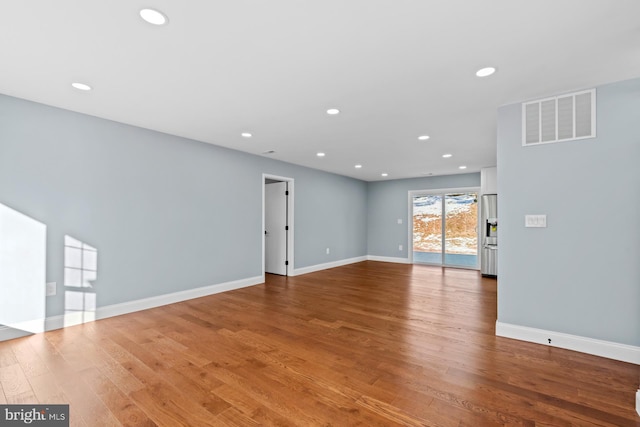 empty room featuring hardwood / wood-style flooring