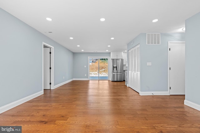 unfurnished living room featuring light hardwood / wood-style floors