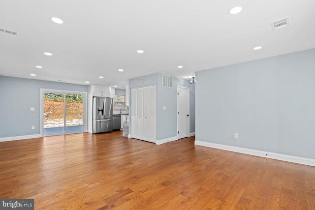 unfurnished living room featuring light hardwood / wood-style flooring