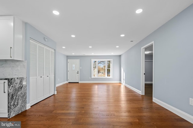 unfurnished living room with hardwood / wood-style flooring