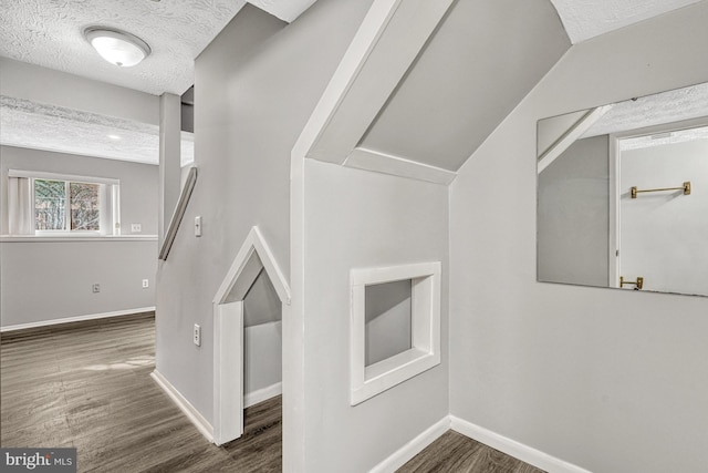 interior space with hardwood / wood-style floors and a textured ceiling