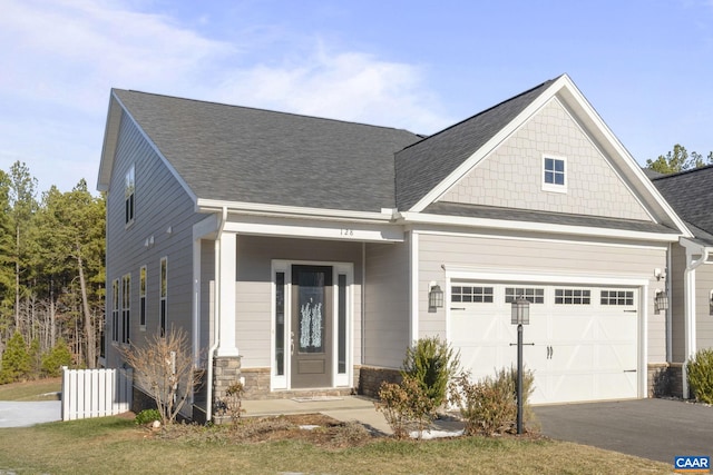 craftsman-style house with a front lawn