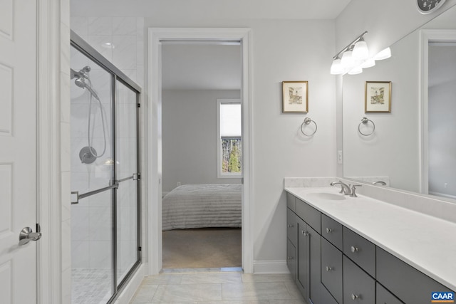 bathroom featuring tile patterned floors, an enclosed shower, and vanity