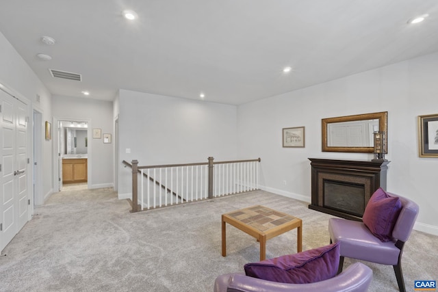 living room featuring light colored carpet