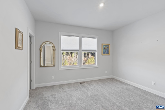 empty room with light colored carpet