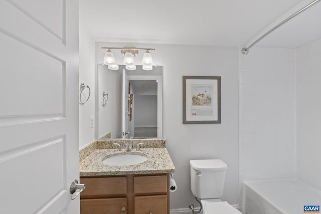 bathroom with toilet and vanity