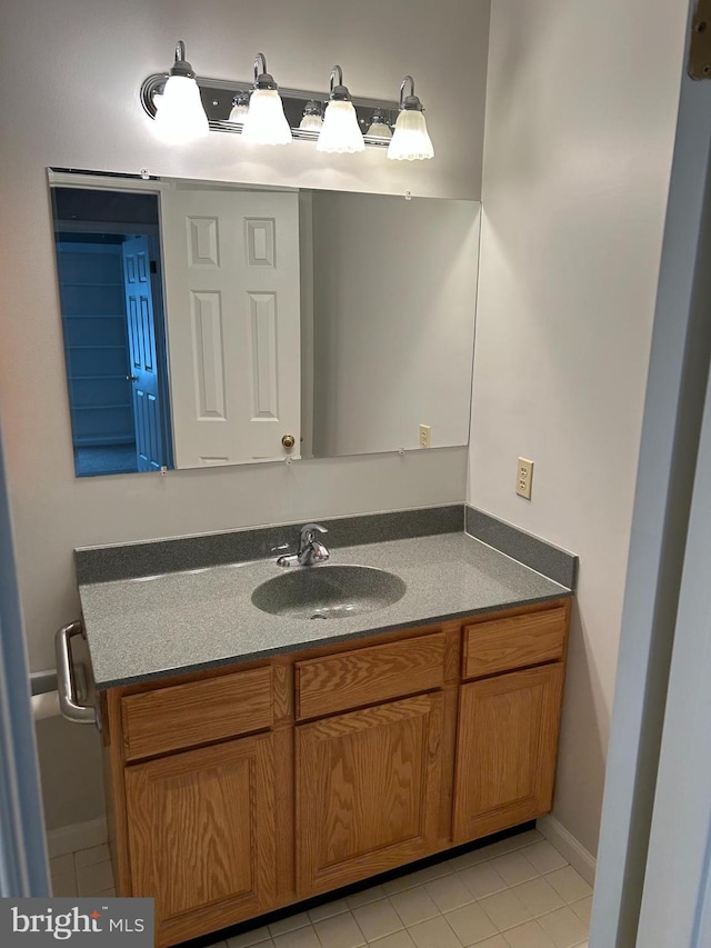 bathroom with vanity and tile patterned flooring