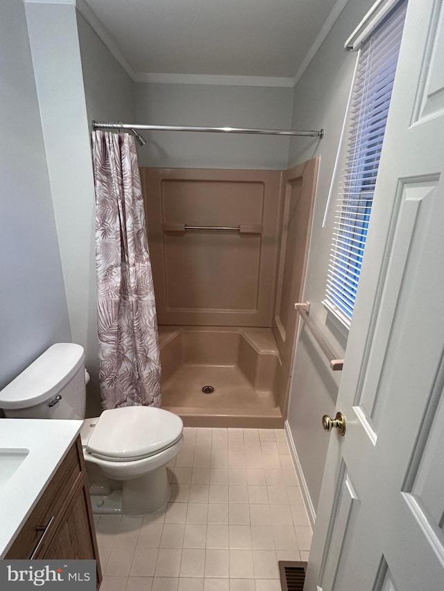 bathroom with toilet, tile patterned floors, crown molding, vanity, and curtained shower