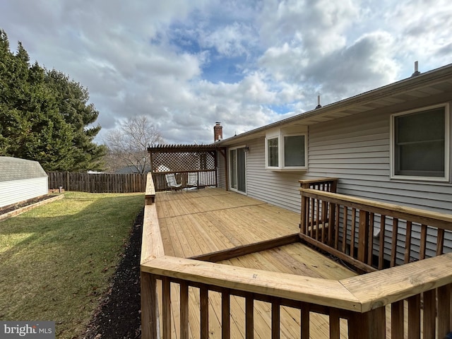 wooden terrace with a pergola and a lawn