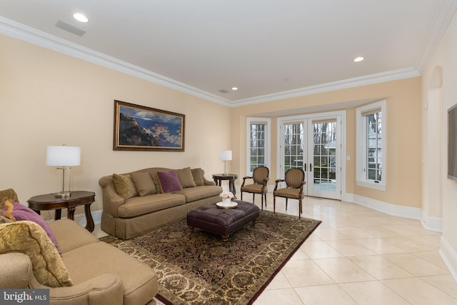 living room featuring light tile patterned floors, french doors, and crown molding