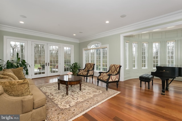 sunroom / solarium featuring french doors