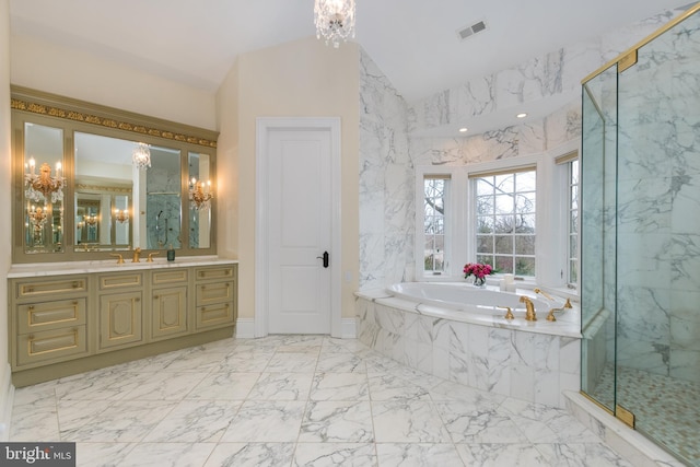 bathroom with shower with separate bathtub, lofted ceiling, vanity, and an inviting chandelier