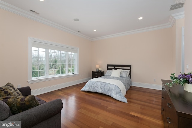 bedroom featuring dark hardwood / wood-style flooring and ornamental molding