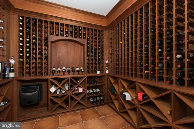 wine area featuring tile patterned floors