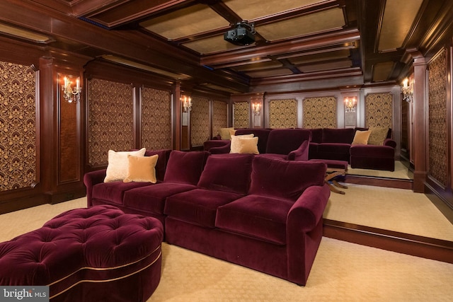 cinema with crown molding, light colored carpet, coffered ceiling, and decorative columns