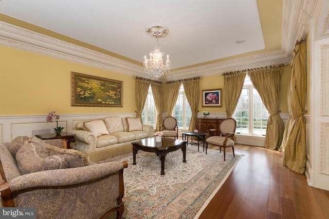 living room with wood-type flooring and a chandelier