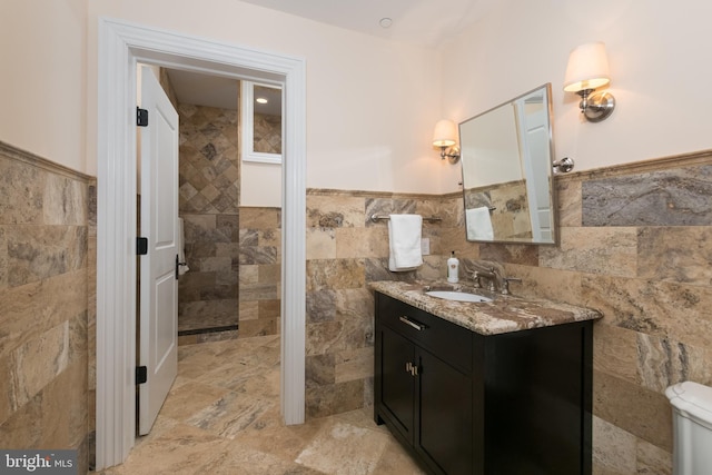 bathroom featuring tile walls and vanity