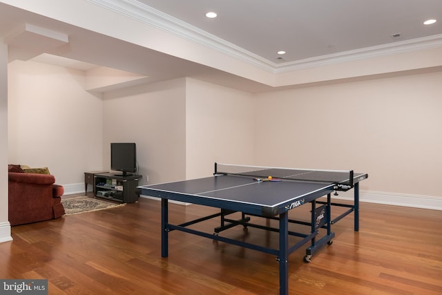 game room featuring ornamental molding and wood-type flooring