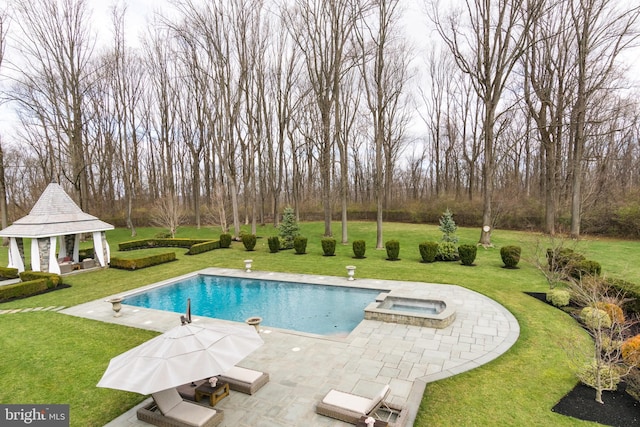 view of pool with an in ground hot tub, a patio area, a gazebo, and a lawn