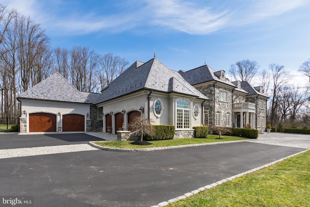 french country home with a garage