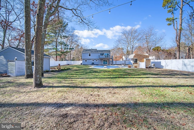 view of yard with a patio area and a storage shed