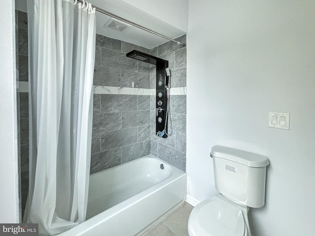 bathroom featuring tile patterned floors, toilet, and shower / bathtub combination with curtain