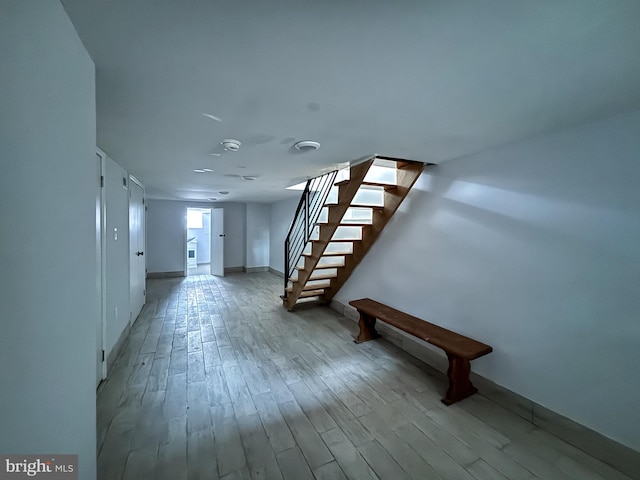 basement featuring light hardwood / wood-style floors