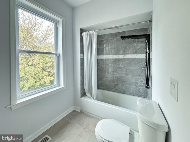 bathroom featuring toilet, tile patterned floors, and shower / bathtub combination with curtain