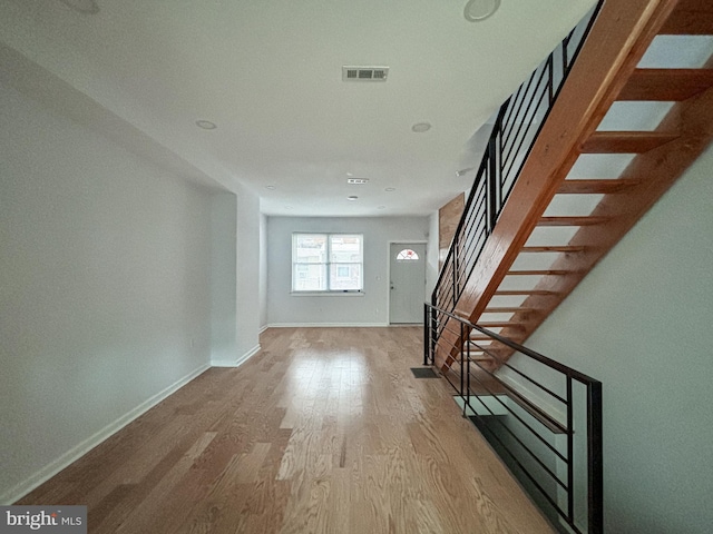 unfurnished living room with light hardwood / wood-style flooring