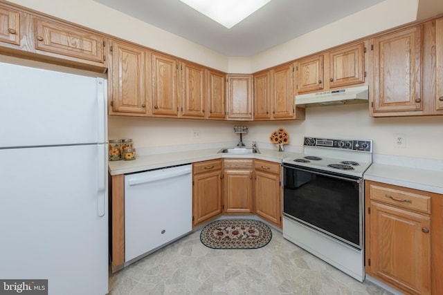 kitchen featuring sink and white appliances