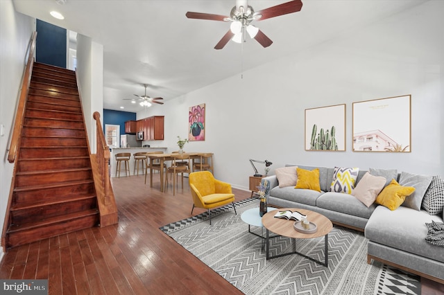 living room featuring ceiling fan and hardwood / wood-style floors