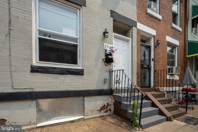 doorway to property with cooling unit