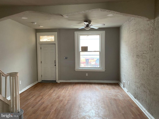 entryway with ceiling fan and light wood-type flooring