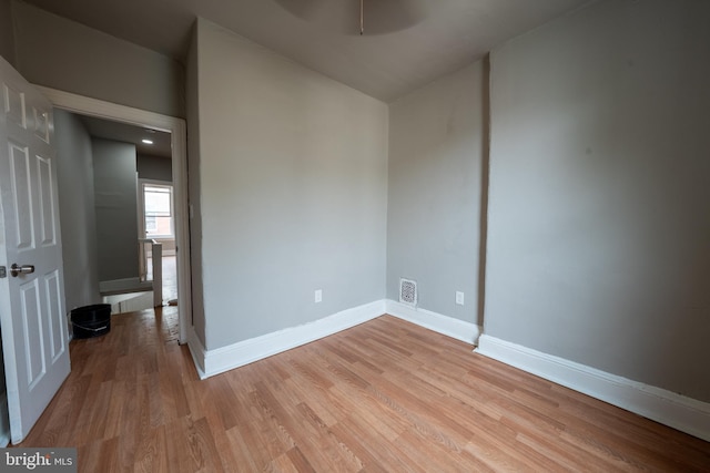 unfurnished room with light hardwood / wood-style flooring