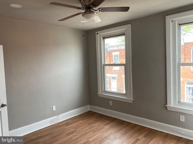 unfurnished room with ceiling fan and light wood-type flooring